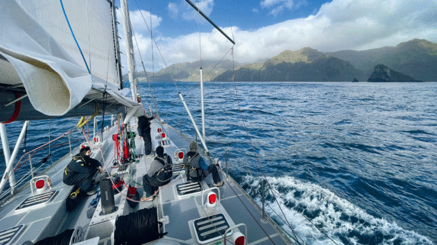 View from the yacht with mountains in the background.