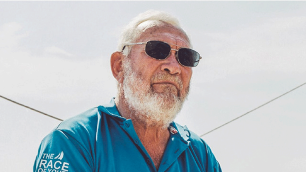 Sir Robin Knox-Johnston with sunglasses on in the sun